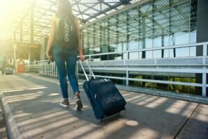 airport deals girl with suitcase