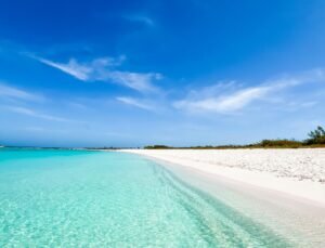 Summer Holiday water Pristine beach with turquoise waters under a clear blue sky in the Caribbean, Venezuela.